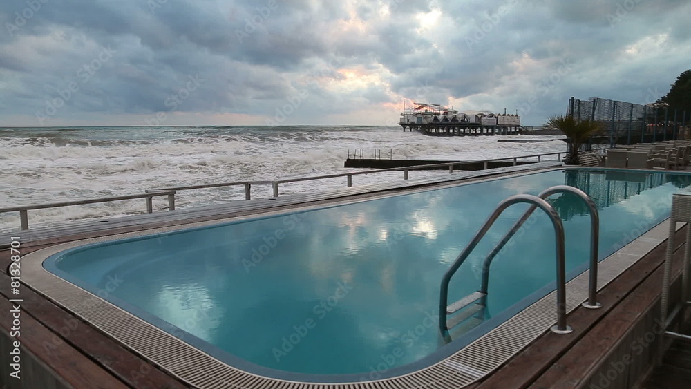 Pool with blue water on the beach in Sochi amid storm in the Pool with blue water on the beach in Sochi amid storm in the