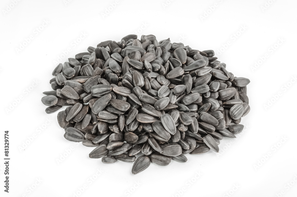Sunflower seeds pile against white background Sunflower seeds pile against white background