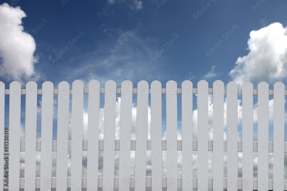 White fence on a blue sky. White fence on a blue sky.