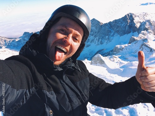 selfie of skier in high mountains