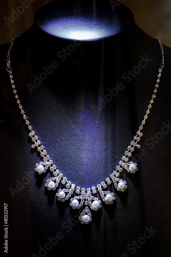 Gold and diamond necklaces isolated on black background.