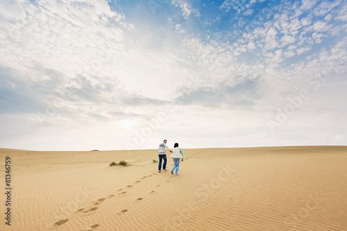 Happy couple in a dune