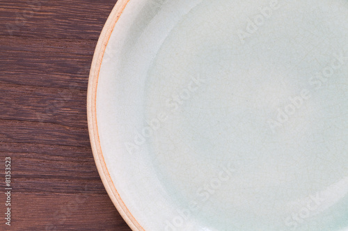 Celadon green ceramic on wood table background