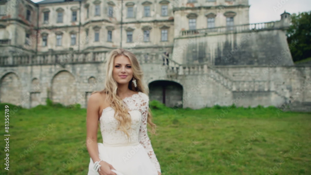 Young beautiful girl with long golden hair in a white dress Young beautiful girl with long golden hair in a white dress