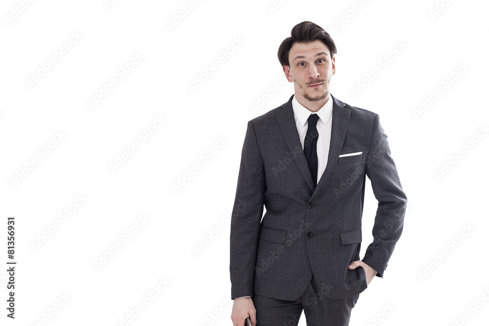 Businessman looking and smiling with hand in pocket Businessman looking and smiling with hand in pocket