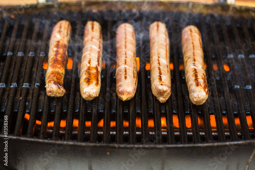 Barbecued beef sausages on grill