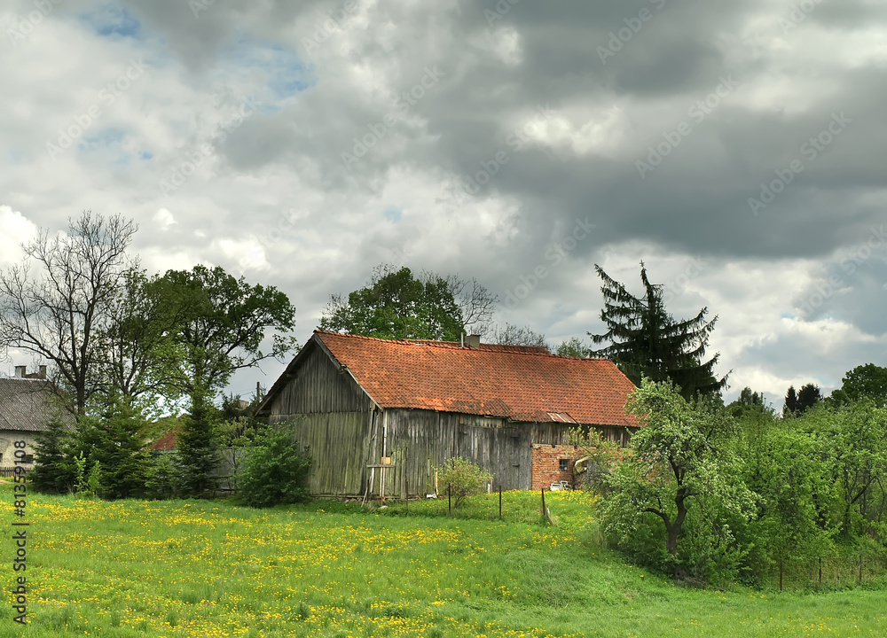Obraz premium old barn in masurian village in Poland