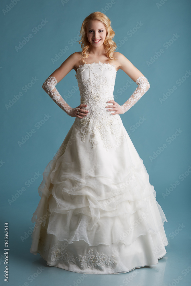 Image of smiling model touts elegant wedding dress
