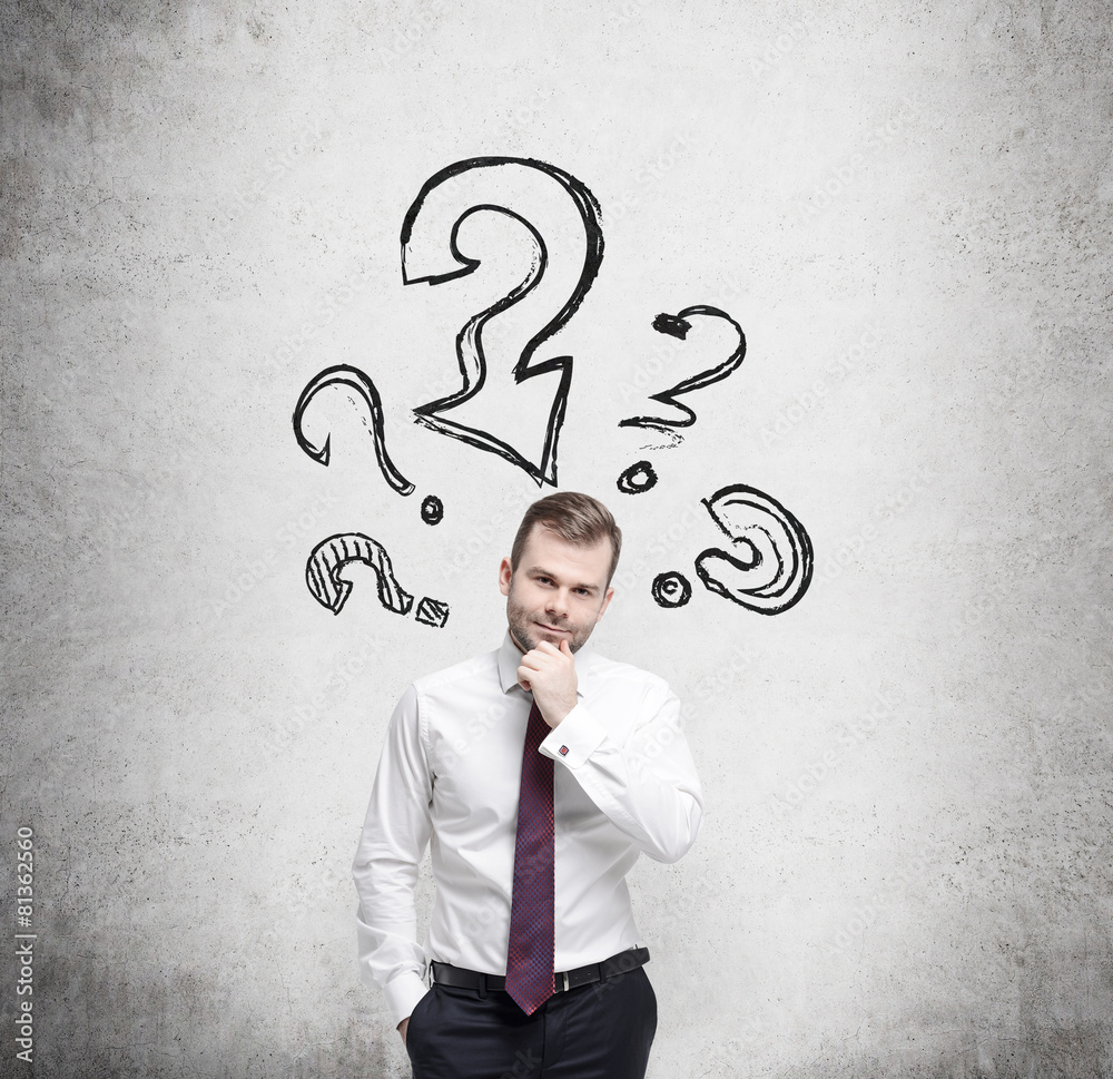 Young businessman is thinking about complicated questions. Young businessman is thinking about complicated questions.