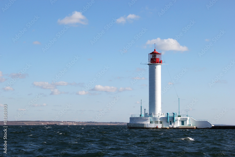 white lighthouse in the sea