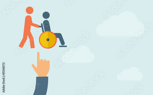 Hand pointing to a man push in wheelchair