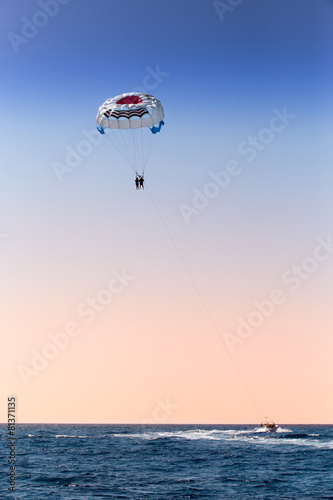 parasailing over blue sea