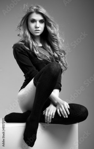 Beautiful woman with long blond hair in studio