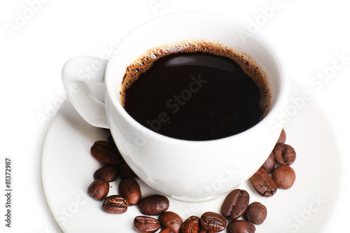 Cup of coffee with grains, closeup