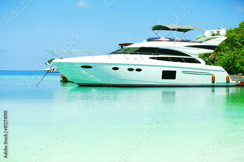 Yacht parked at jetty in Baros Maldives © Africa Studio