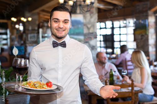 Happy waiter with a tray © JackF