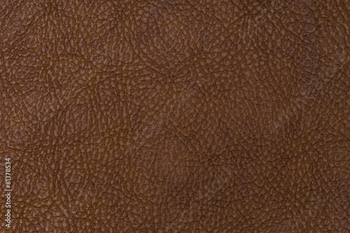 brown leather texture closeup can be used as background.