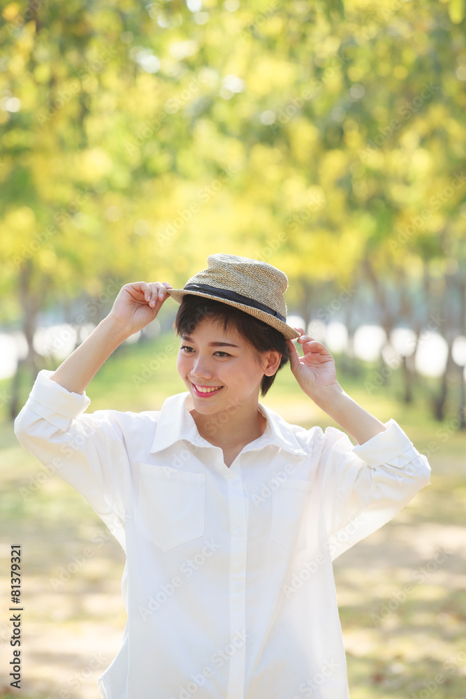 portrait of young beautiful asian woman wearing straw hat with s