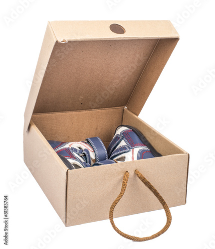 box with man's sandals isolated on a white background