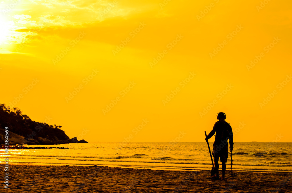 Electronic beach combing, Hua Hin Thailand with sun rise.