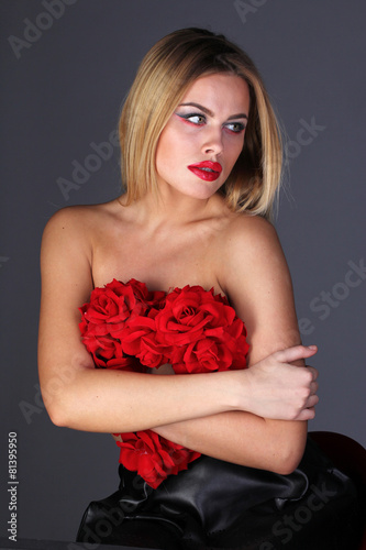 Attractive blond covered of roses