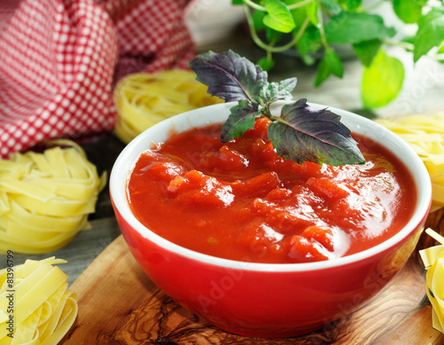 фотографія Home made passata in the red bawl
