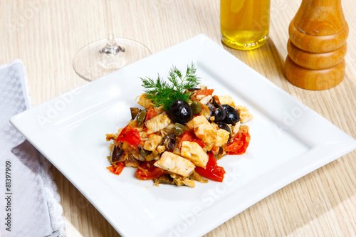 Swordish with tomatoes, capers and olives, sicilian recipe