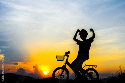 Fototapeta Naklejka Na Ścianę i Meble -  Silhouette of the cyclist riding a road bike at sunset