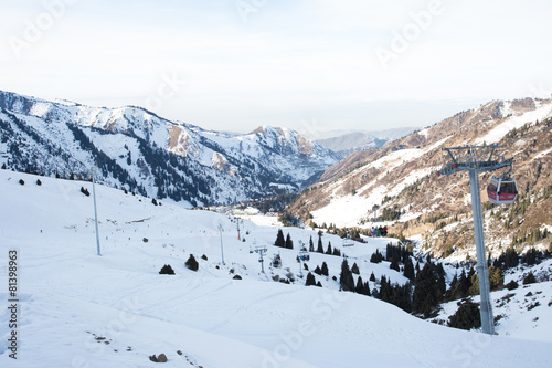 The cable car in the snowy mountains Chimbulak © frizzyfoto