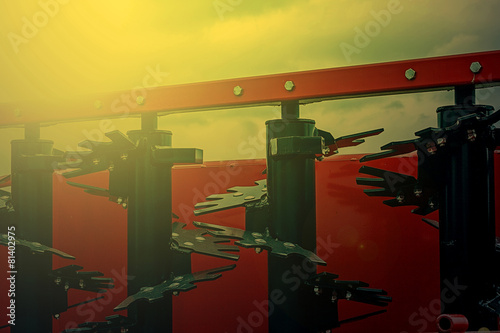 Agricultural equipment in sunset light. Detail 20