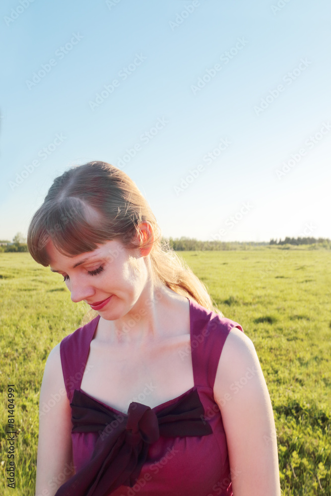 Closeup beautiful smiling girl in meadow in sunny summer day Closeup beautiful smiling girl in meadow in sunny summer day