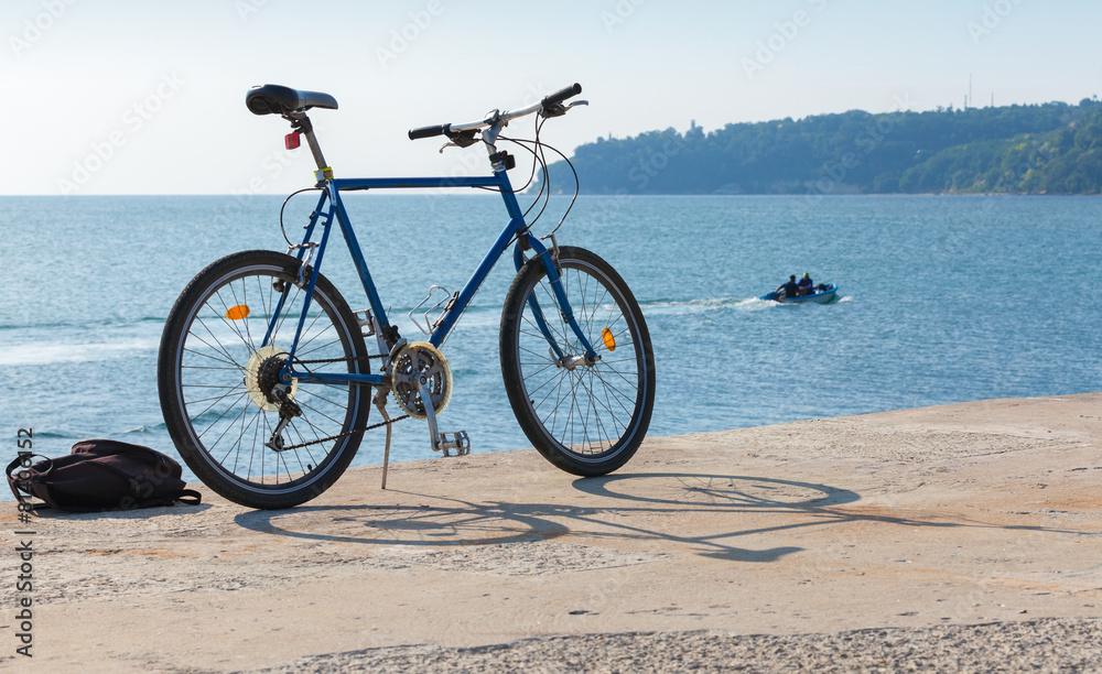 Fototapeta premium Bicycle stands on the pier, Black Sea coast