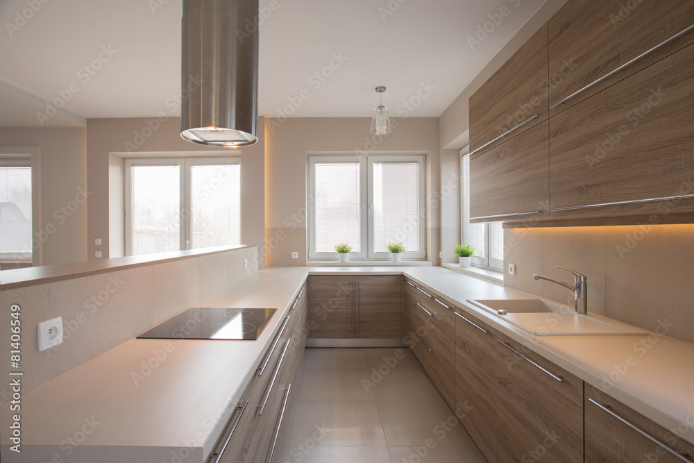 Wooden cupboards in beige kitchen Wooden cupboards in beige kitchen