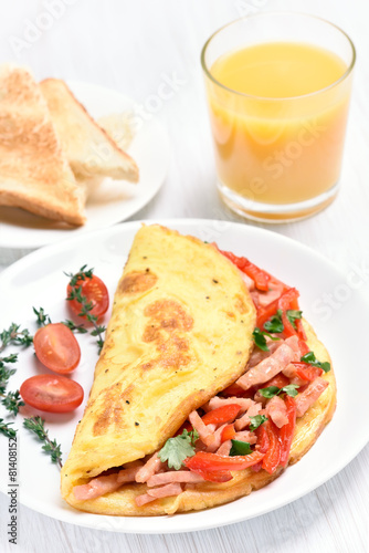 Egg omelette with vegetables and ham