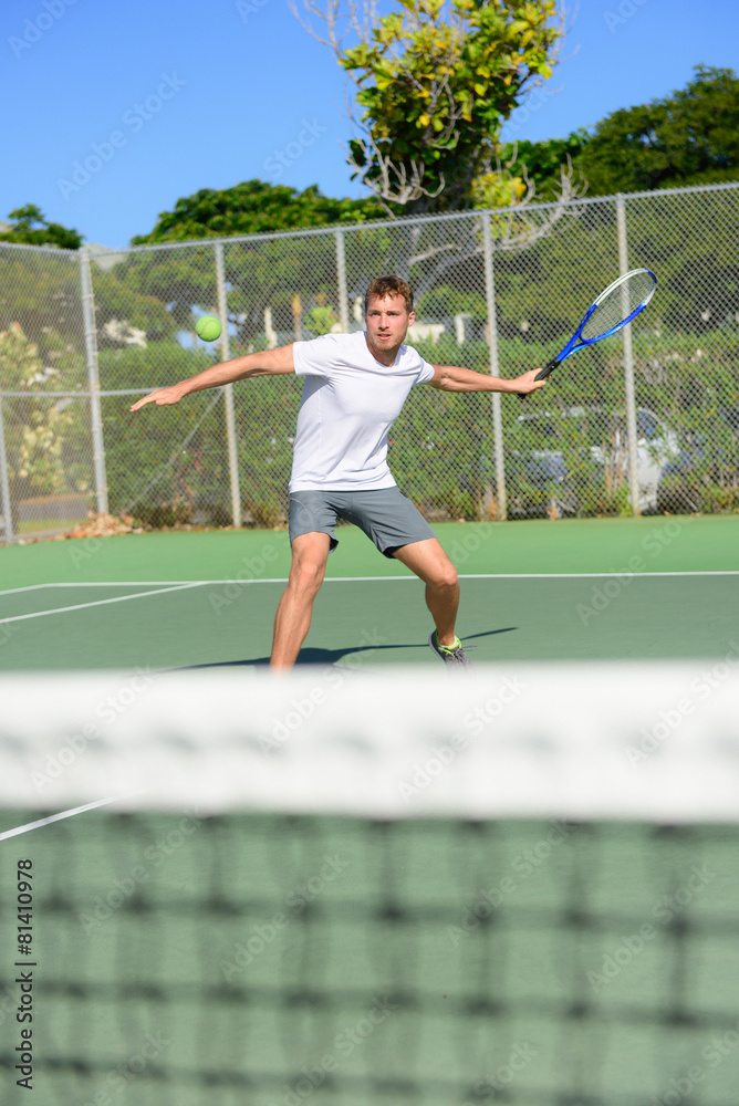 Tennis player - man hitting forehand playing