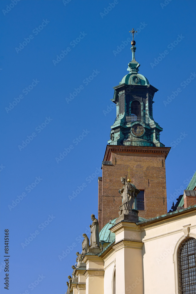 Tower and statues at the Basilica of the Archdiocese of Gniezno.