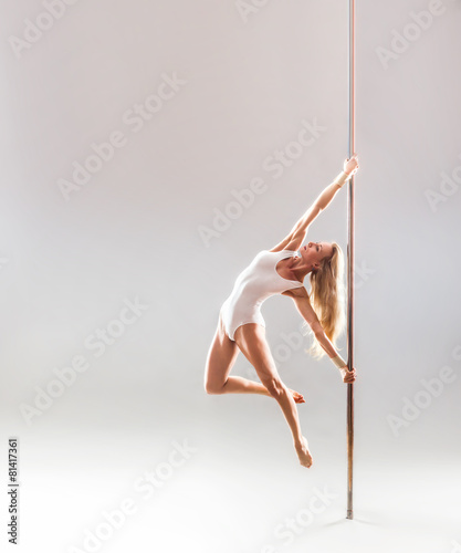 Beautiful blonde sexy pole dance woman