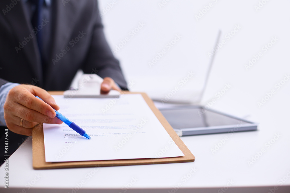 Businessman holding a blank white board Businessman holding a blank white board