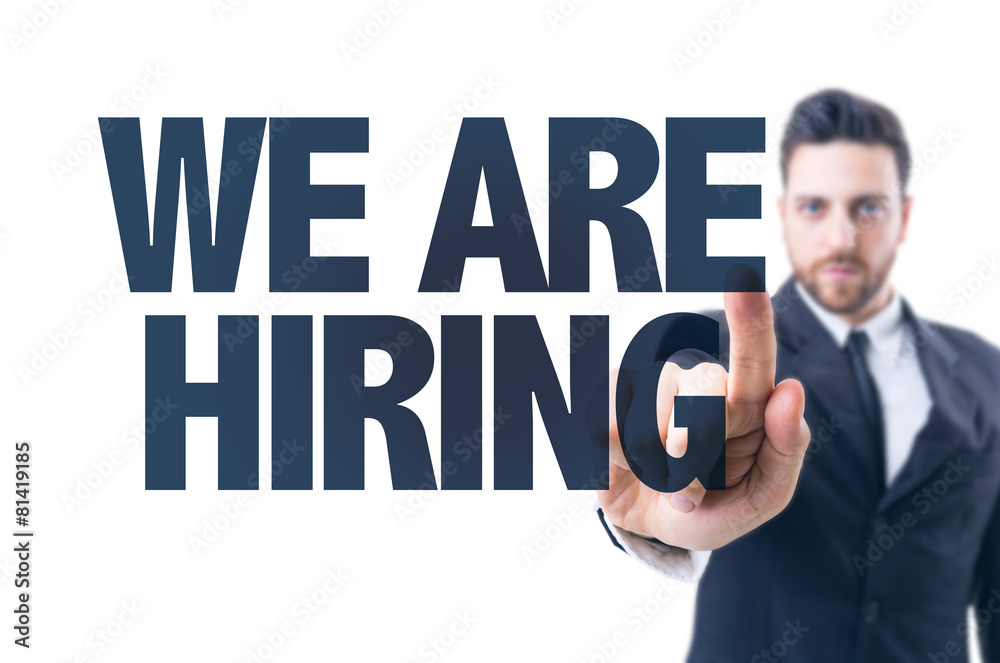 Business man pointing the text: We Are Hiring Business man pointing the text: We Are Hiring