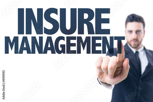 Business man pointing the text: Insure Management