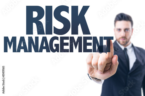 Business man pointing the text: Risk Management