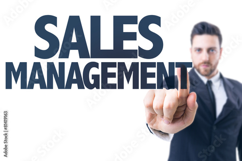 Business man pointing the text: Sales Management