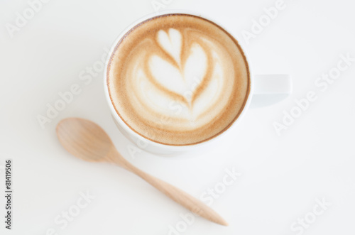 a cup of latte art on white background