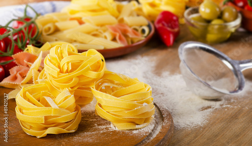 Italian food ingredients with pasta and vegetables.
