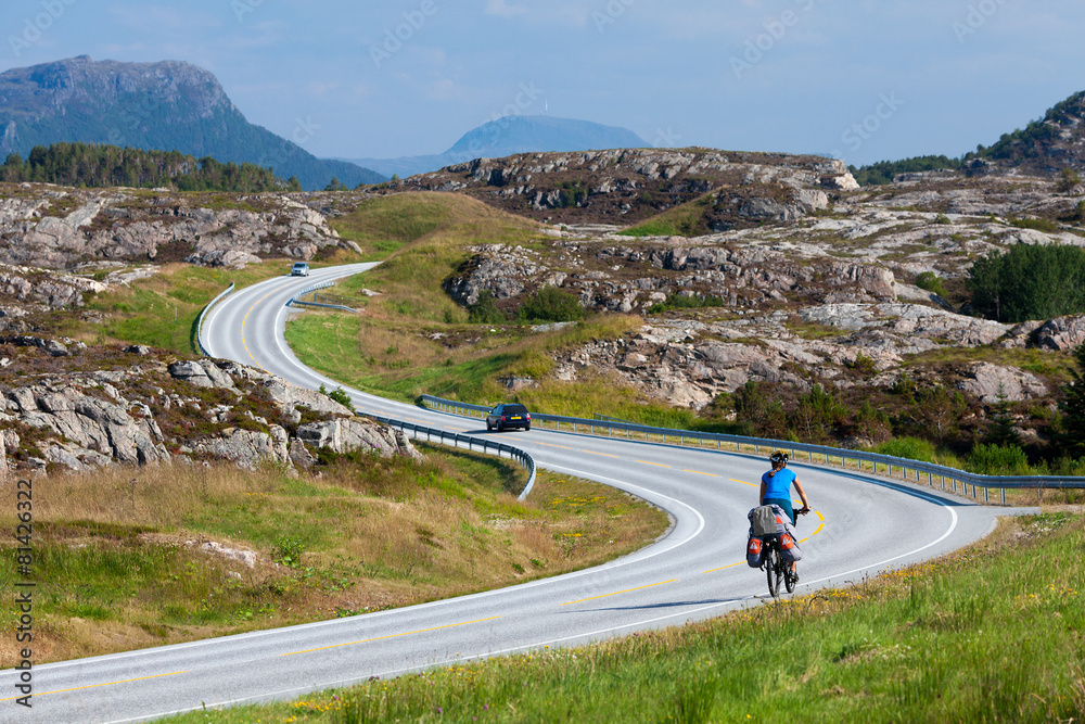 Biking in Norway against picturesque landscape Biking in Norway against picturesque landscape