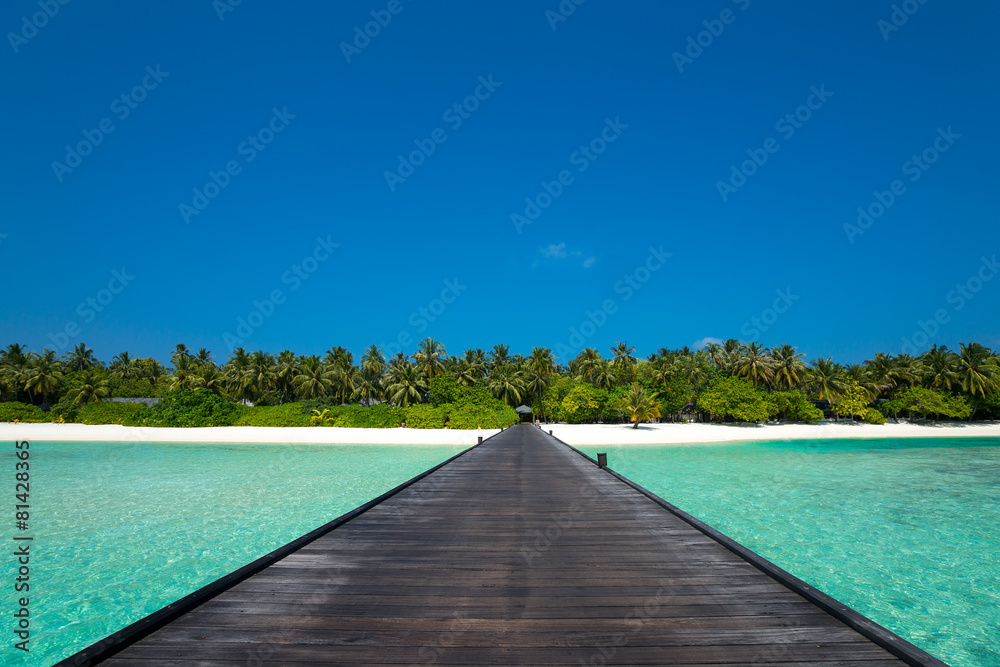 Wooden pier with blue sea and sky background