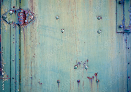Background with Faded green chipped paint and hinge