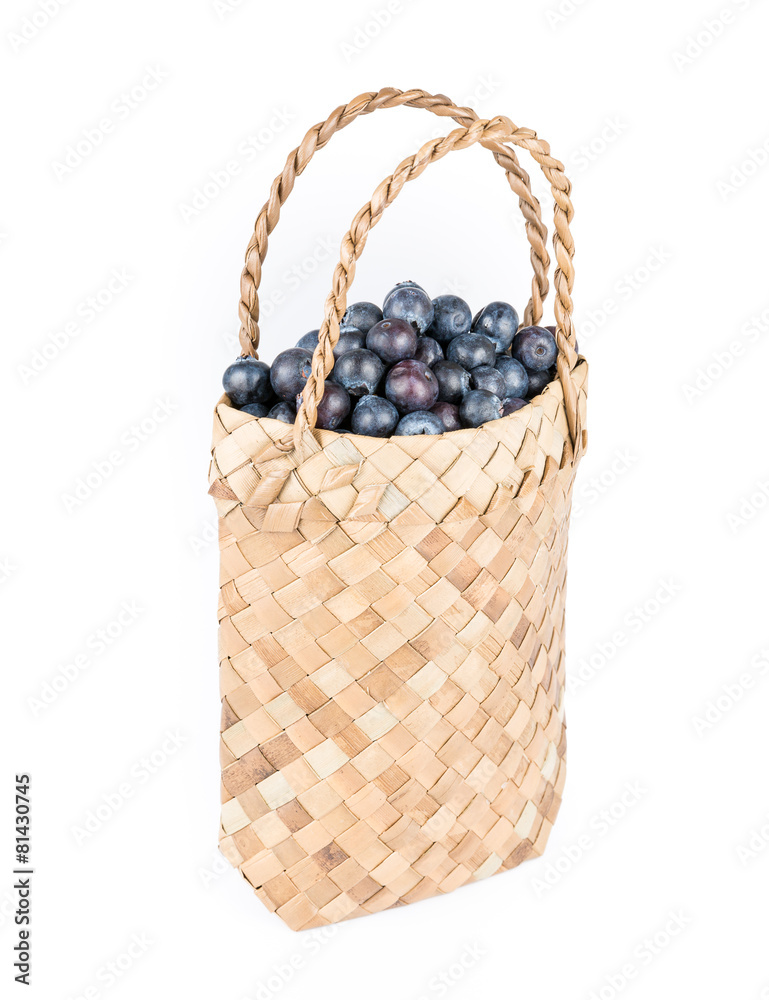Wicker basket with Blueberries Isolate on white Wicker basket with Blueberries Isolate on white