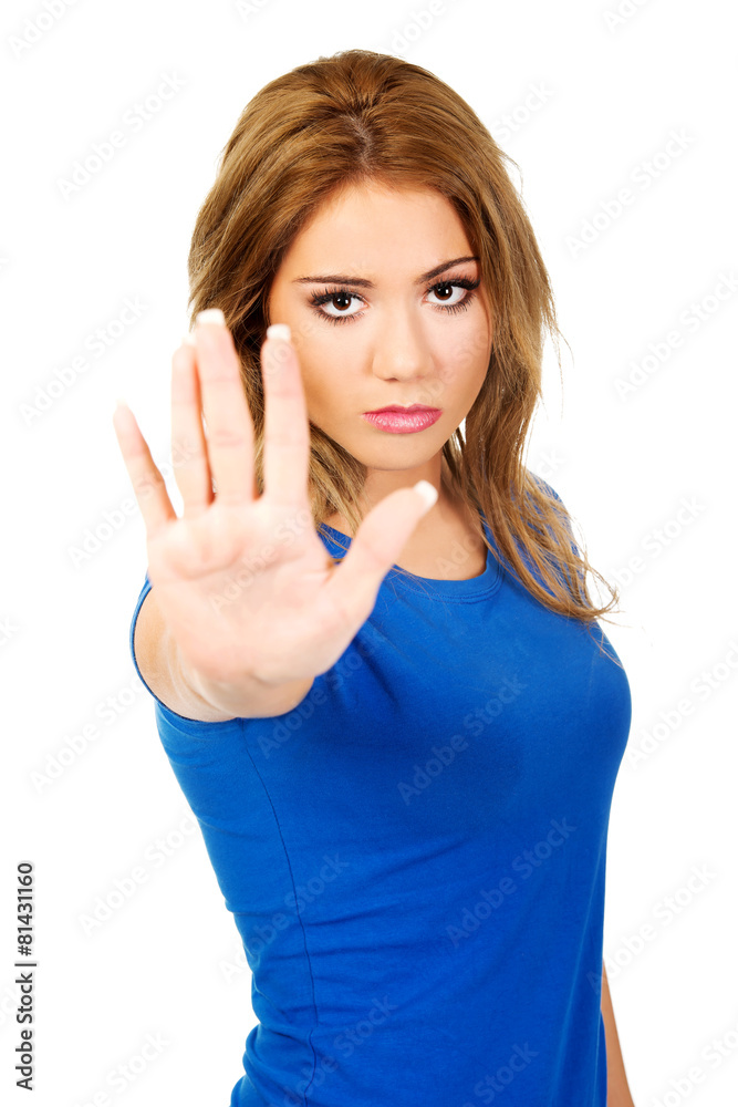 Young woman making stop sign. Young woman making stop sign.