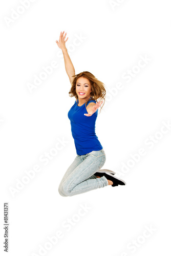Young happy woman jumping.
